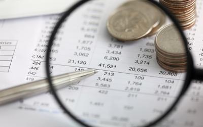 magnifying glass over balance sheet