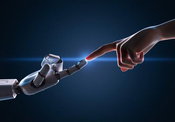 human finger touching a robot finger