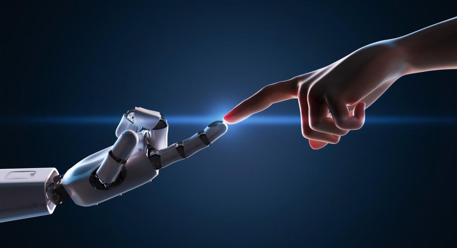 human finger touching a robot finger