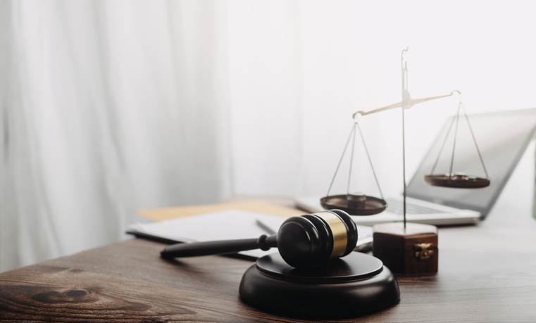 Photo of a gavel on a desk.