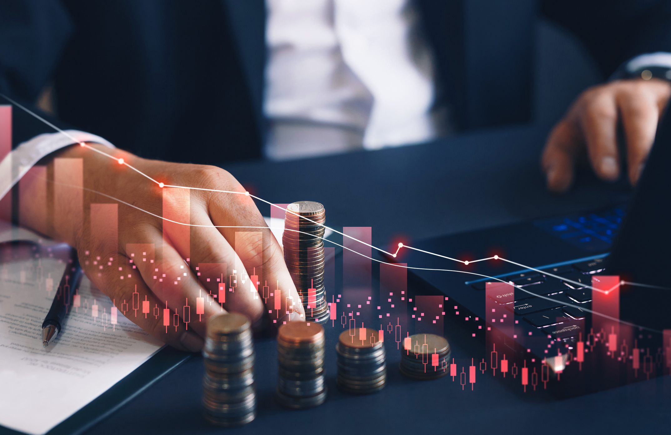 man's hand counting coins with graph overlaid