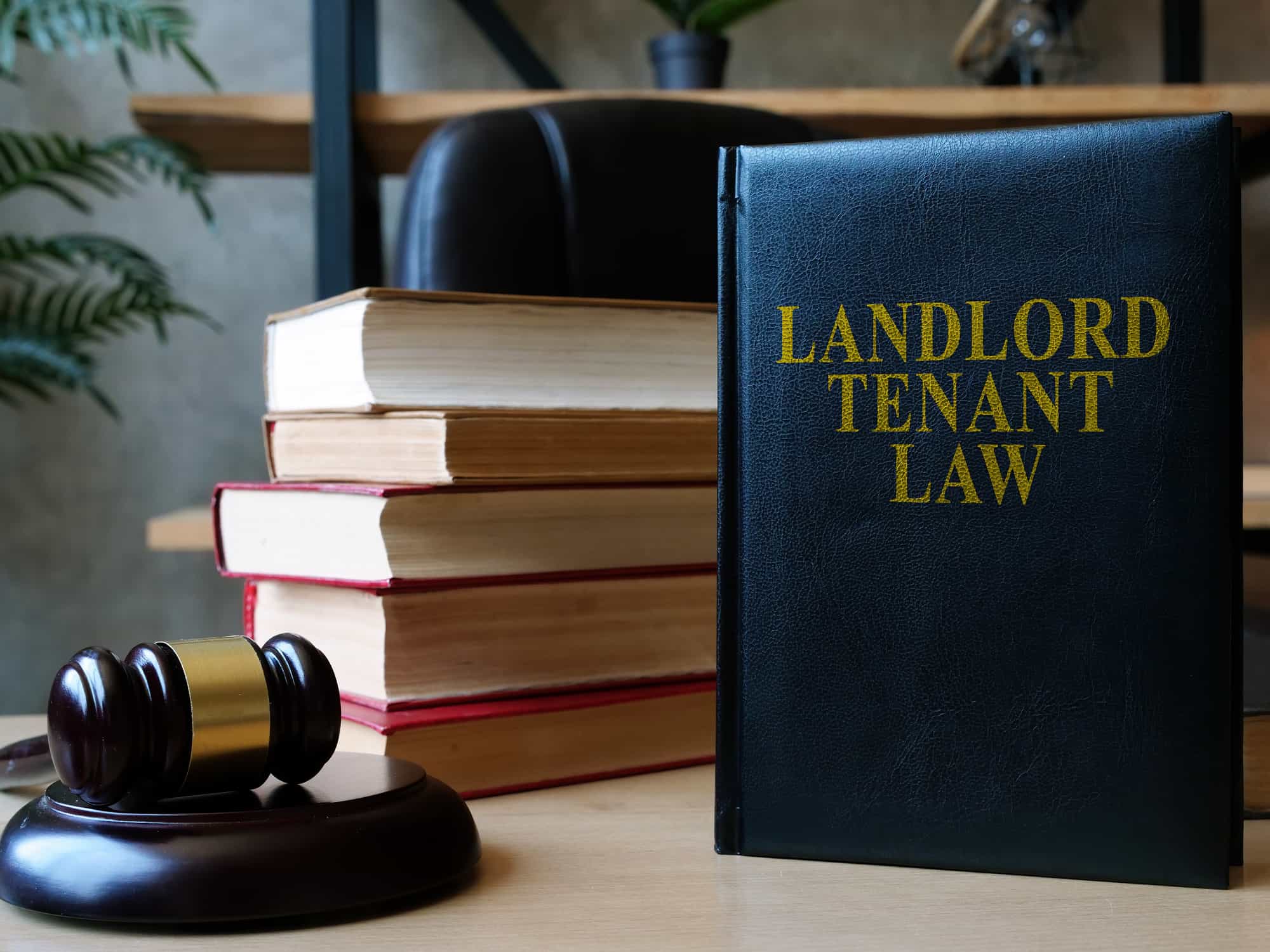 book of landlord and tenant laws on a desk with a gavel