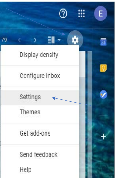 The settings icon in Gmail (in the shape of a gear) with the popup menu and a blue arrow pointing to the Settings option
