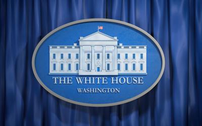 Photo of a sign with reading "The White House, Washington"