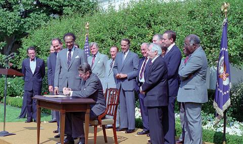ronald reagan signs the 1988 Fair Housing Amendments Act