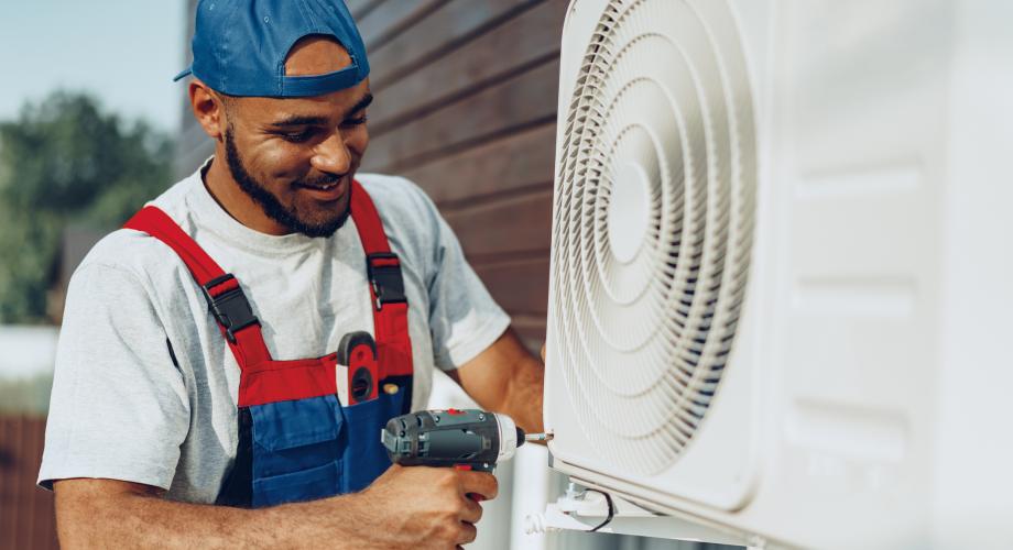 repairman installing air conditioner