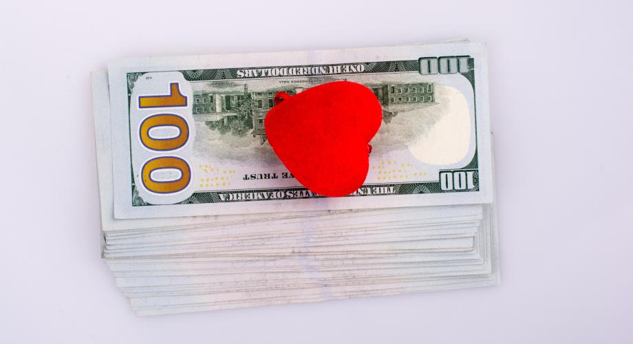 100 dollar bills with heart on top