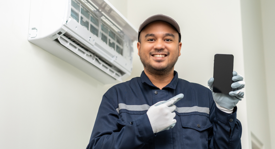 maintenance worker holding phone